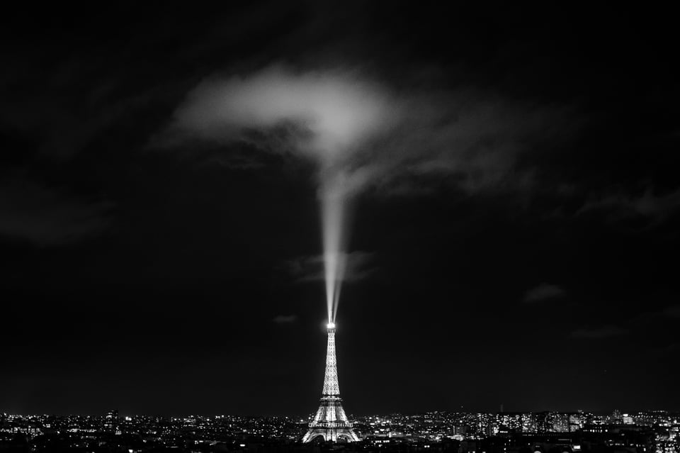 This photo shows the Eiffel Tower with a spotlight in the air. It took a lot of visualization to plan how this photo would look.