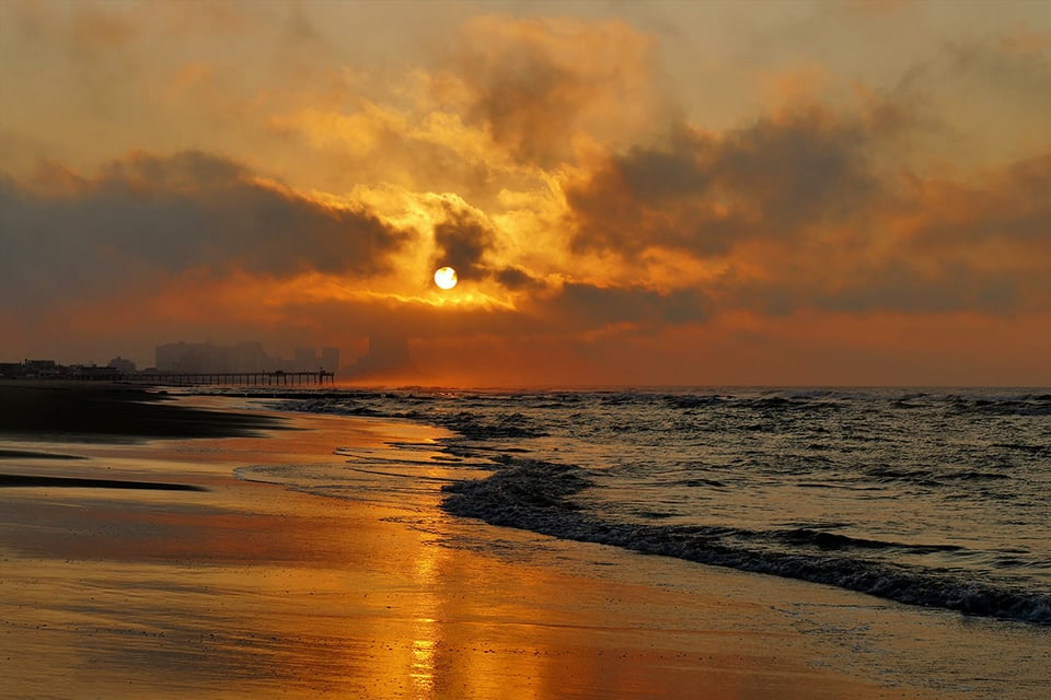 This is taken from Margate, NJ looking towards Atlantic City. The early morning fog at sunrise created an atmospheric setting