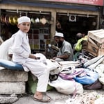 This young man was helping his father set up shop