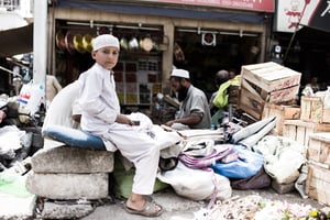 This young man was helping his father set up shop