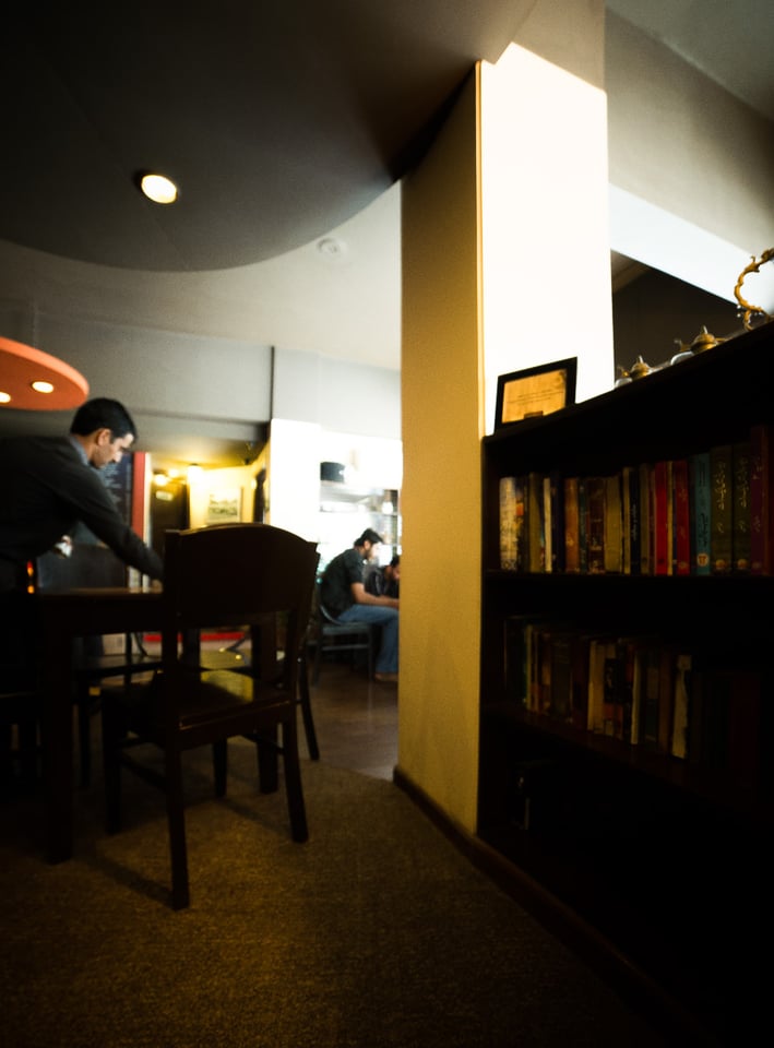 Caption: Waiter at an upscale chai khana (tea house) that services the capital's elites (notice stark contrast with the previous image)