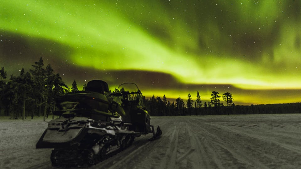 Northern Lights and Snowmobile