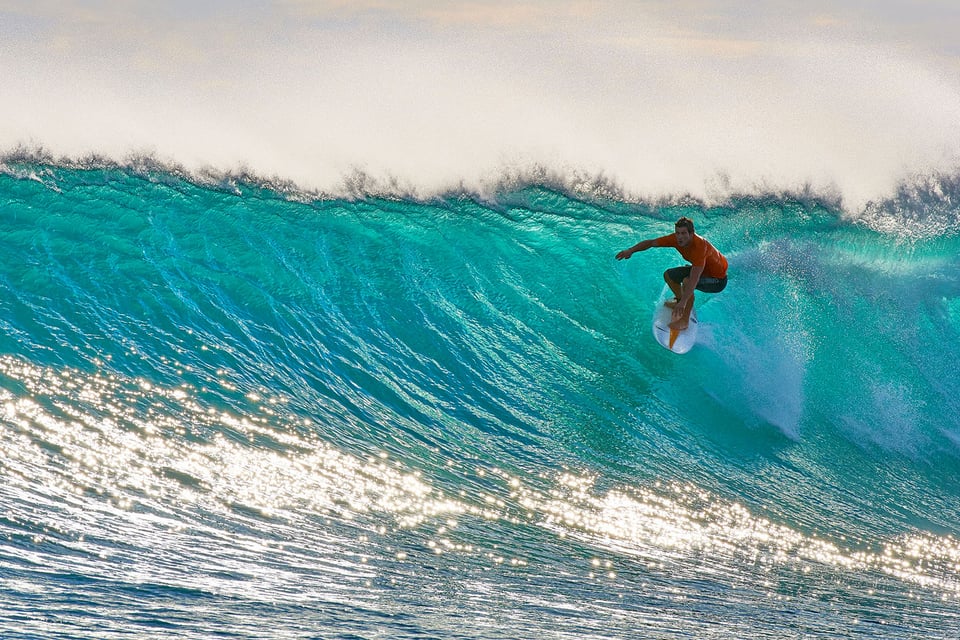 Surfer in Turquoise Wave