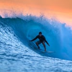 Surfing Waves at Sunset