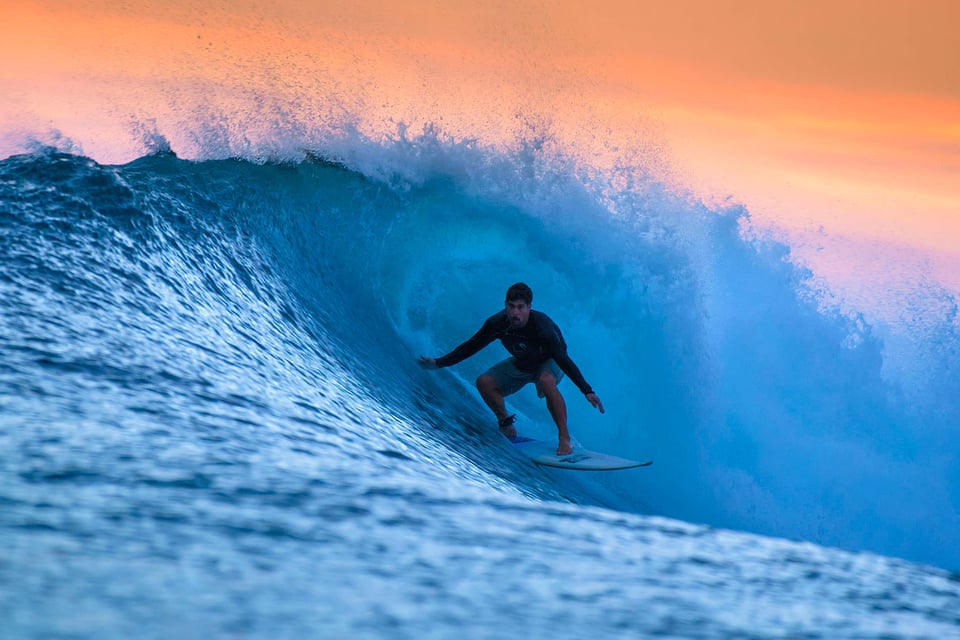 Surfing Waves at Sunset