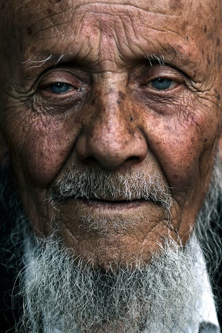 Travel Portrait of Man with Blue Eyes