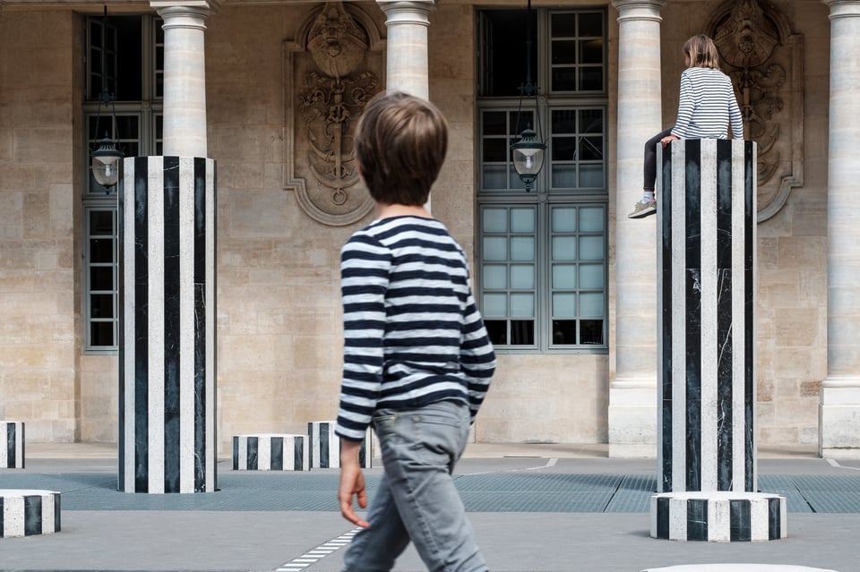 Good street photography tells a story. This photo's composition is filled with striped patterns that make it look more interesting.