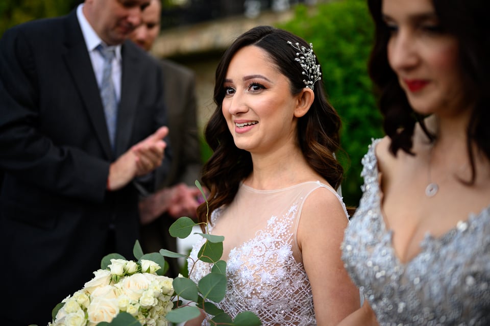 This image of a happy bride needed a little bit of dodging to bring out her face and some skin imperfections had to be addressed in Photoshop