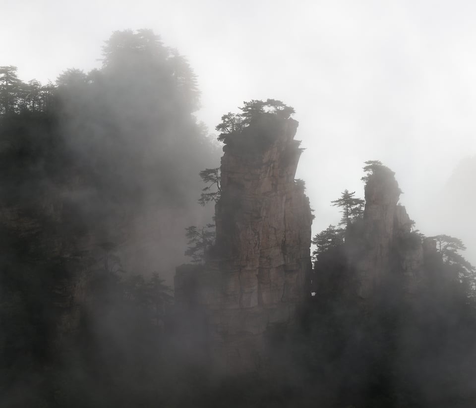 This photo shows the beautiful mountains of Zhangjiajie in China on a foggy morning.