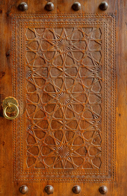 Hand-carved wooden door of the Poi Kaplan Mosque
