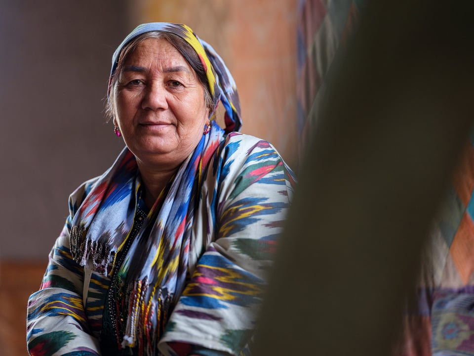 A woman from Ferghana Valley dressed in traditional Uzbek silk clothing