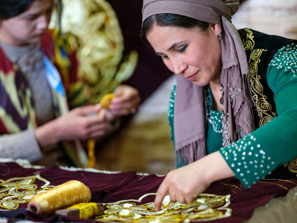 Dressmakers working on female Uzbek dresses