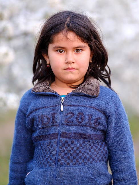 A portrait of an Uzbek girl working in a fruit farm in Uzbekistan