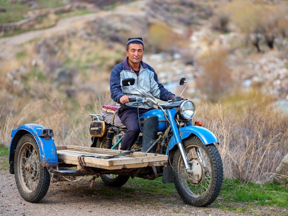 An Uzbek man on a Russian motorcycle