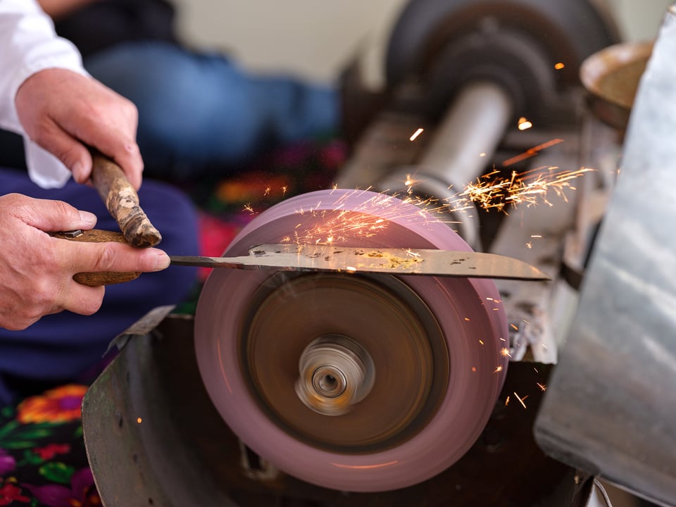 Chust Blacksmith Sharpening a Knife