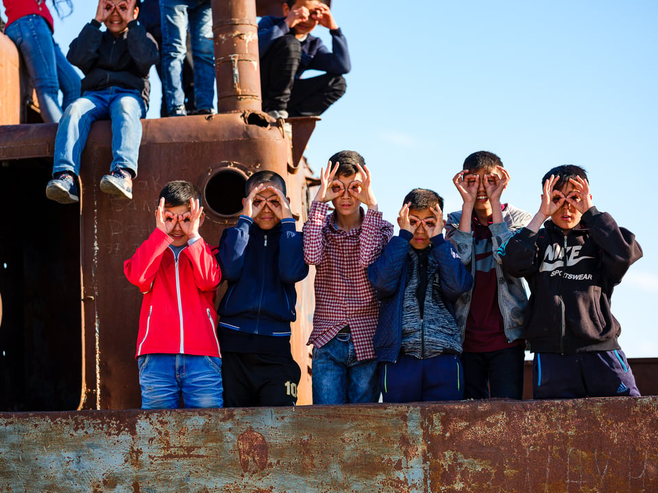 Karakalpak kids playing in ship graveyard