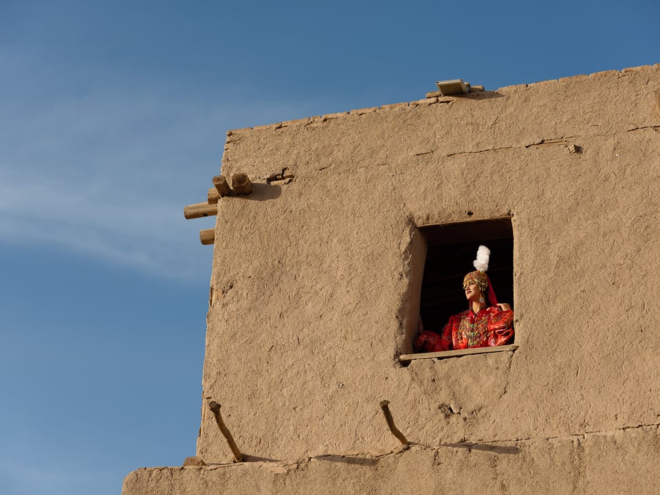 Khiva performer looking out of window
