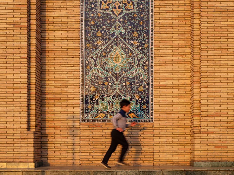 Child playing in Khast Imam ensemble grounds