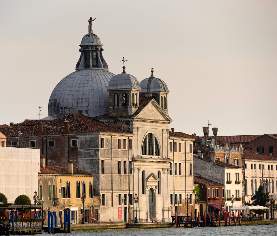 Evening sun catches the façade of the church of Le Zitelle