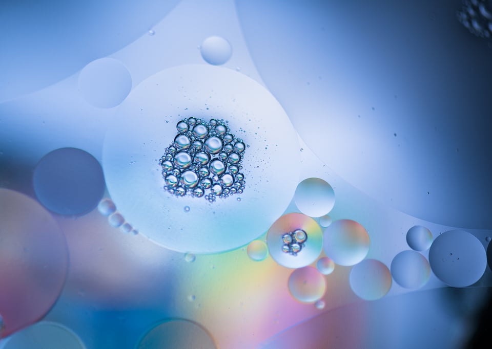 Oil on water macro photo with bubbles