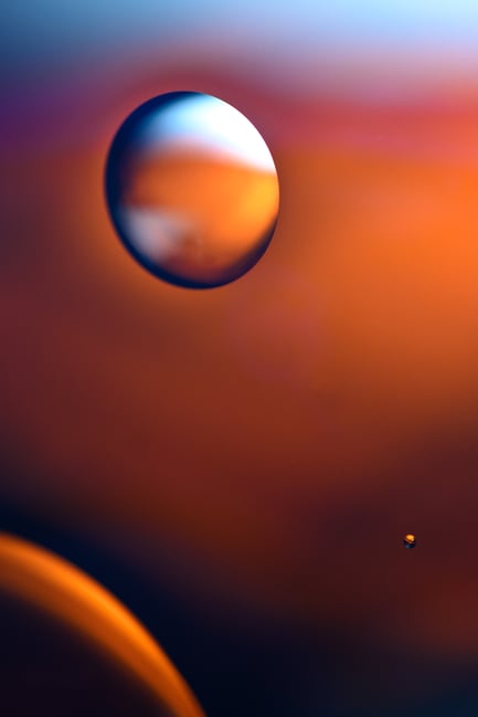 Orange photo of oil floating on top of water