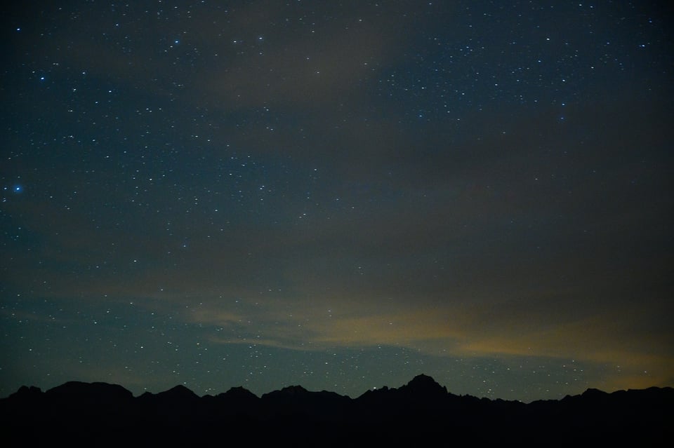 Telephoto image of the stars at night with 20 seconds of exposure, showing star trails from focal length