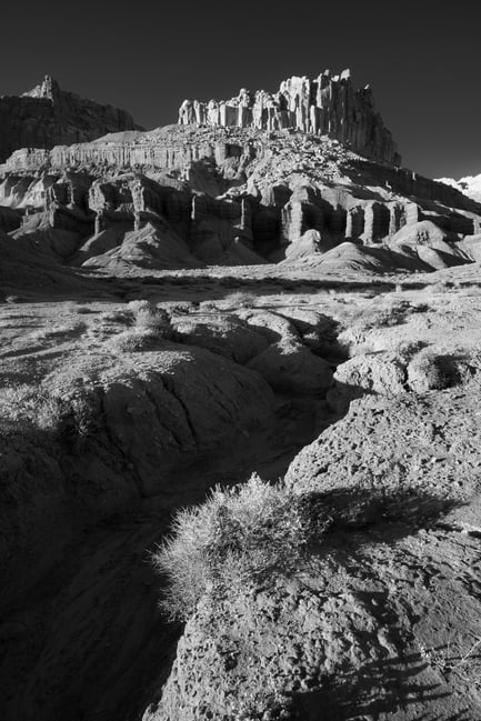 Distant rock formation with high-contrast leading line in the foreground