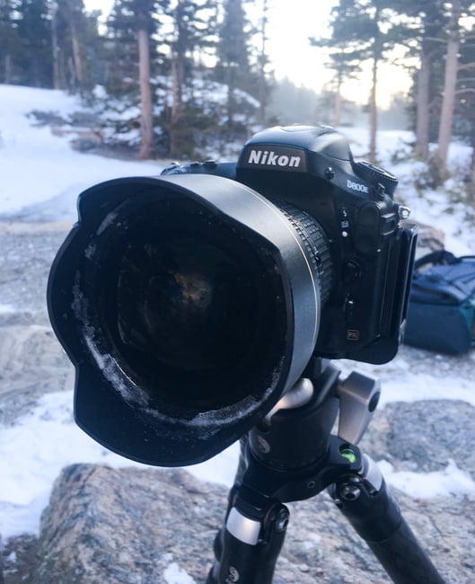 Ice around from element of lens in cold weather