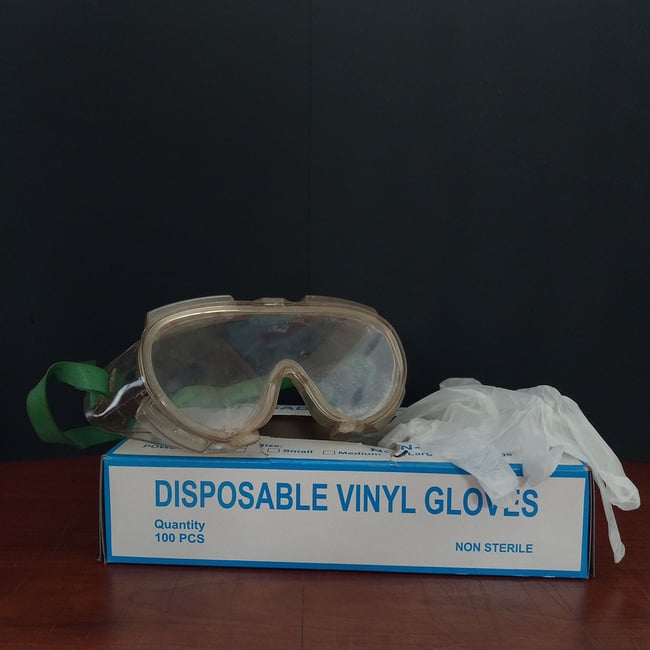 Disposable gloves and safety goggles for proper protection