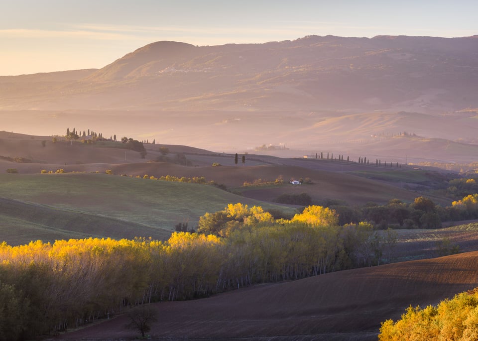 Telephoto landscape Tuscany with closest element in the bottom right corner