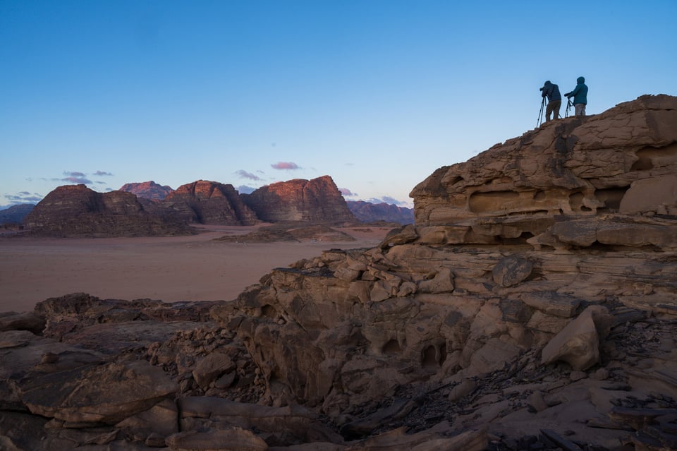 Two Landscape Photographers with Tripods at Sunrise from an Overlook