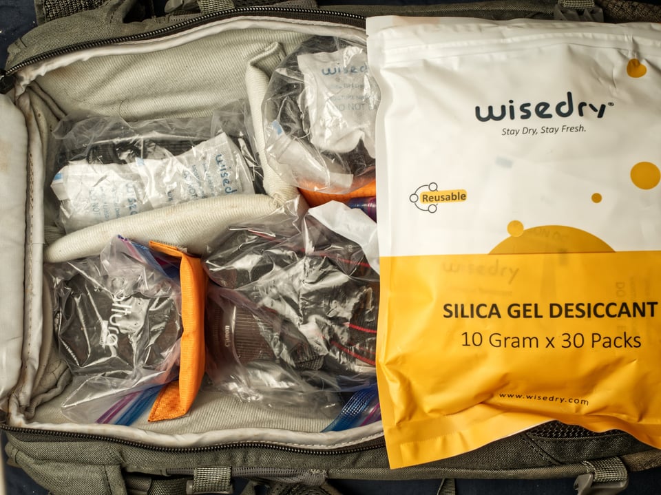Protect camera gear from humidity by using silica gel packets as a desiccant