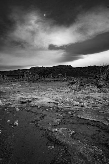 High Contrast Black and White Photo with Rock Formations and the Moon in Mono Lake