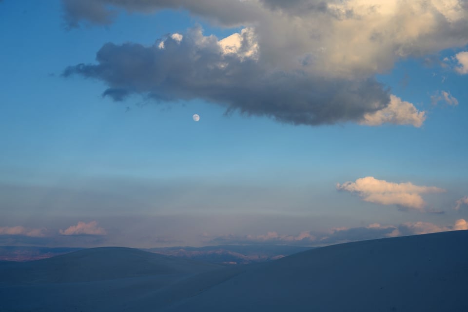 Moon at Sunset over sand dunes