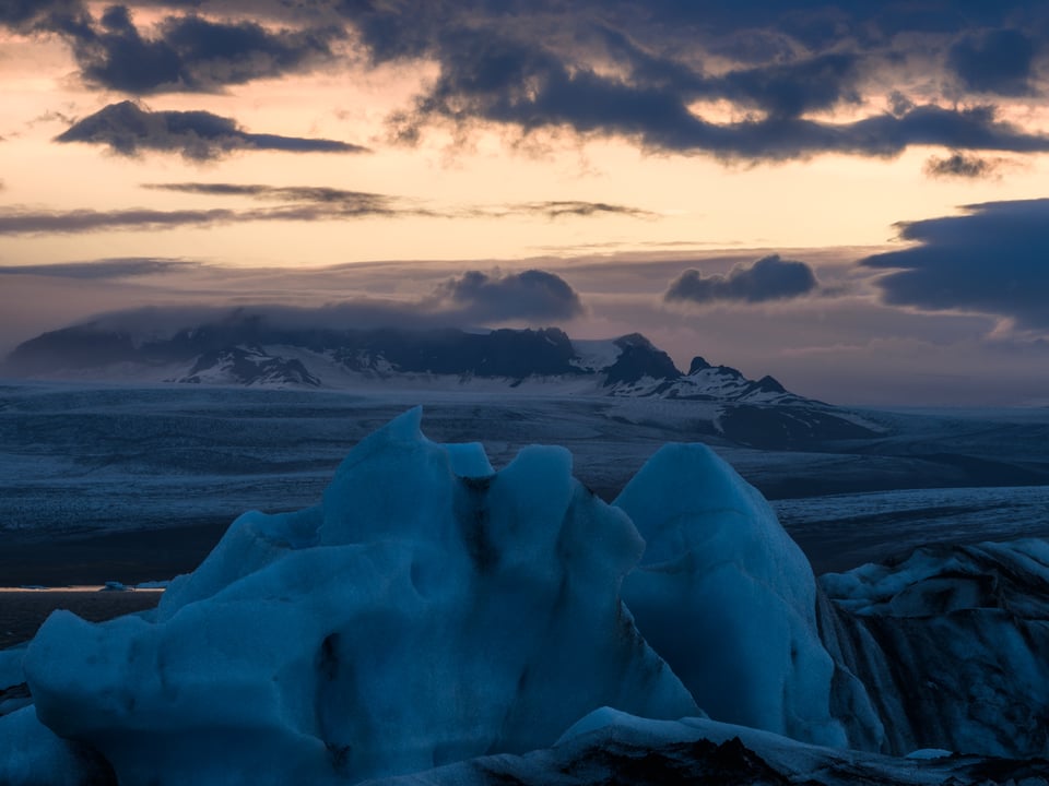 Dark Sky over Glacier and Iceberg