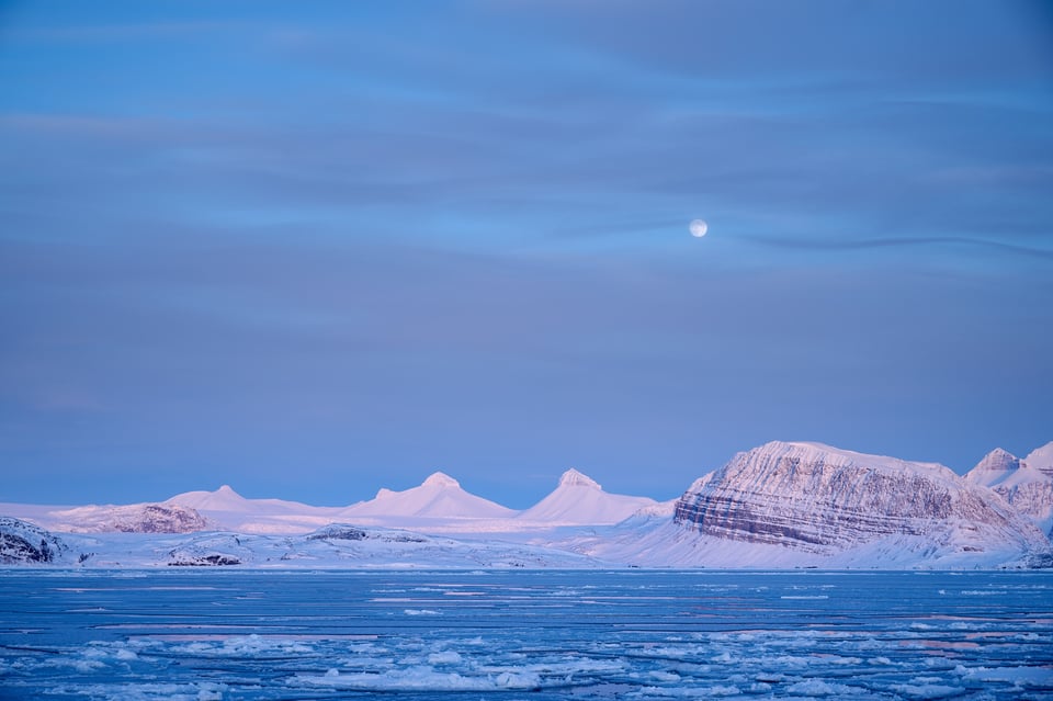 New moon raising on the svalbard ice