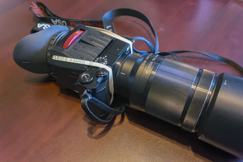 Zacuto Z-Finder attached to back of Nikon 1 J5 with elastic bands.