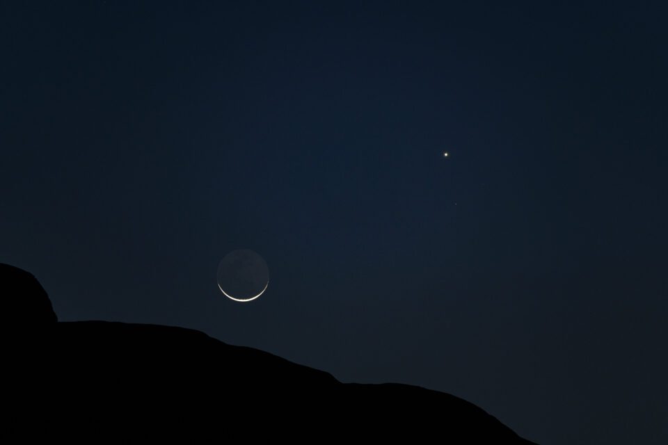 Crescent moon and Venus with some foreground