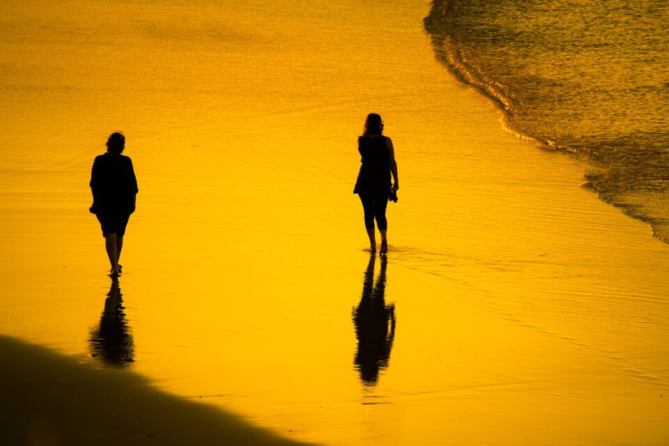 Walking-on-a-Beach-at-Sunset