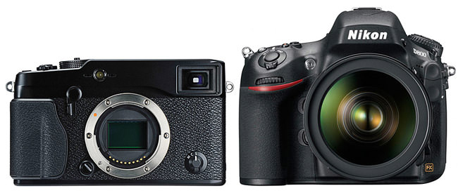 A Fuji mirrorless camera next to a Nikon DSLR.