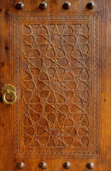 Hand-carved wooden door of the Poi Kaplan Mosque