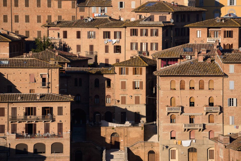 Sunlit buildings in Siena Italy