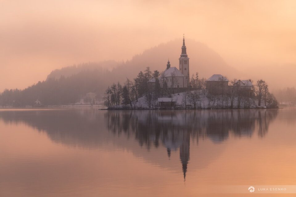 Lake Bled island backlit on a winter morning