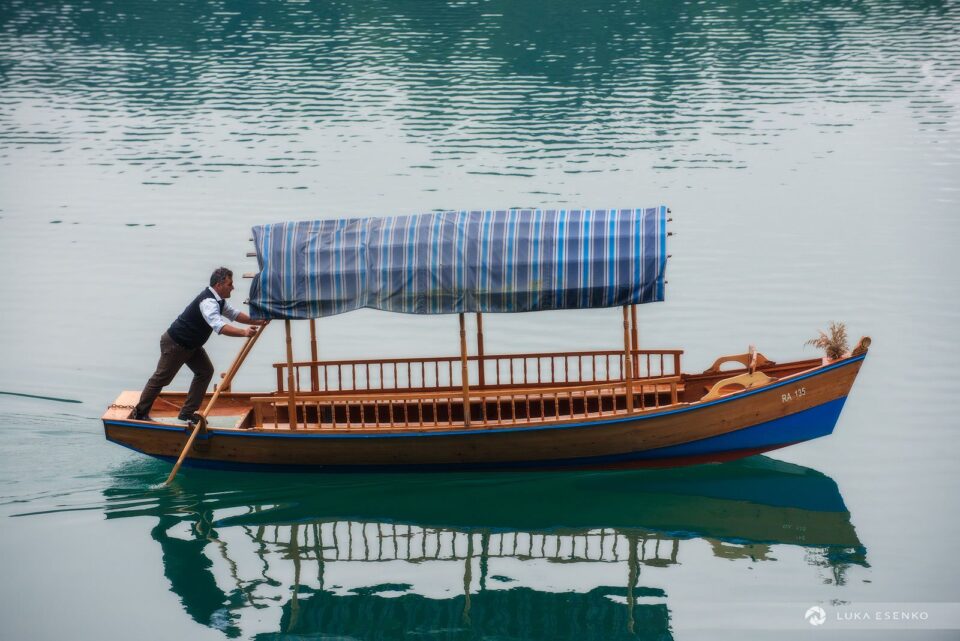 Going to work… Pletna boat rower at Lake Bled