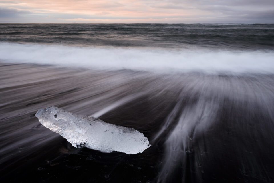 Iceberg on the beach with pastel sunset light - not good lighting in this case